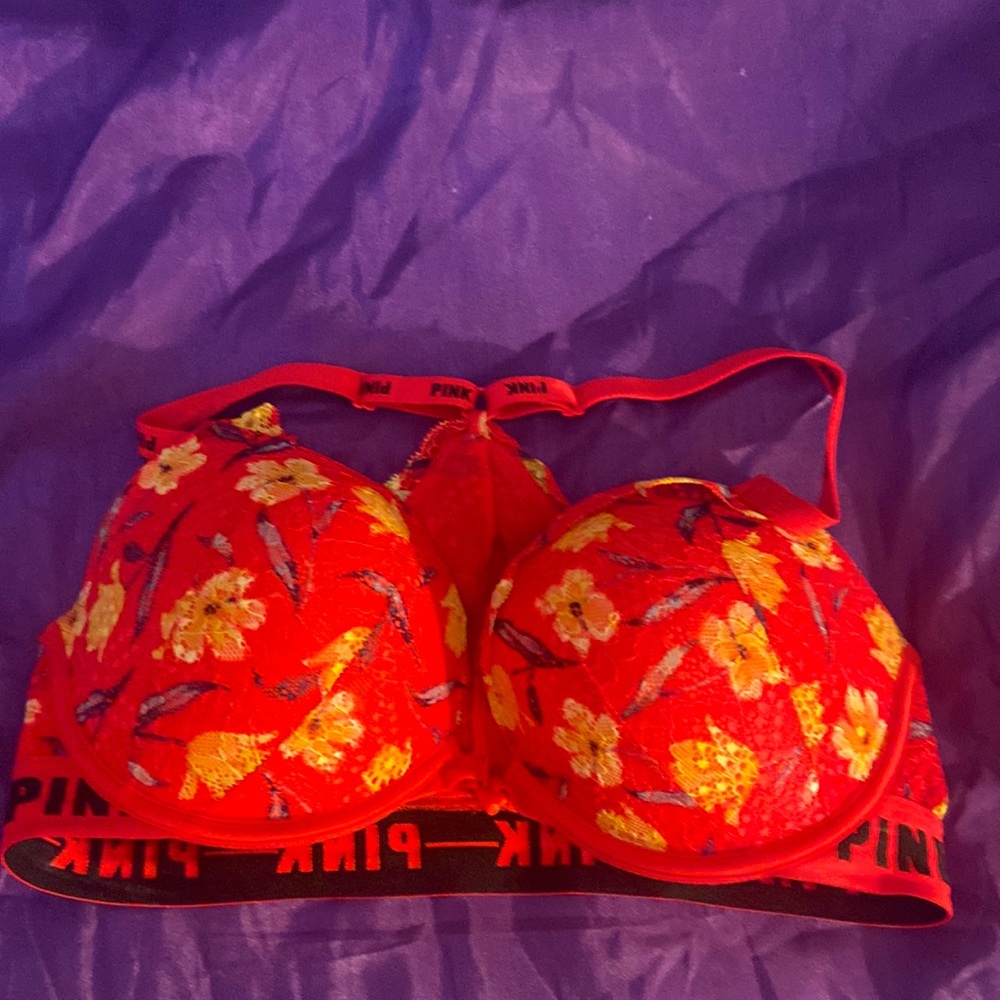 Pink lacy razor back bra.